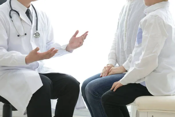 Pediatric doctor talking with parent